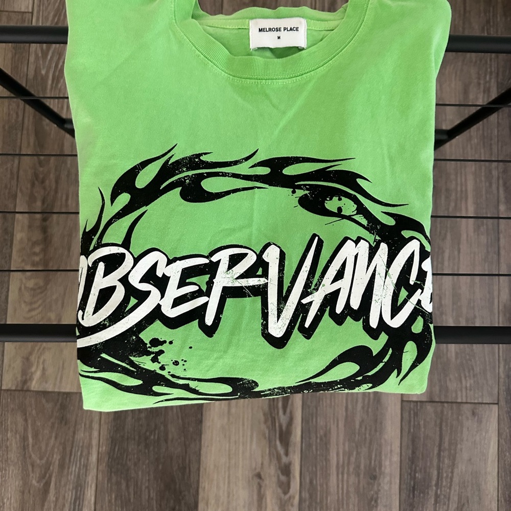 Vibrant Green Long Sleeve Tee with Bold Graphic Design